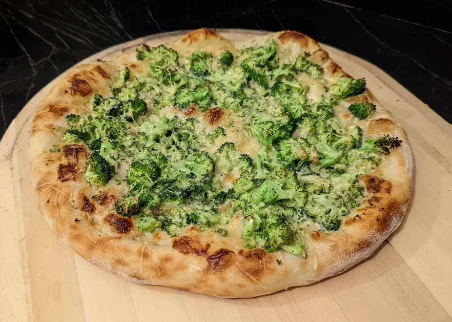 Broccoli Alfredo pizza, baked on a steel.
