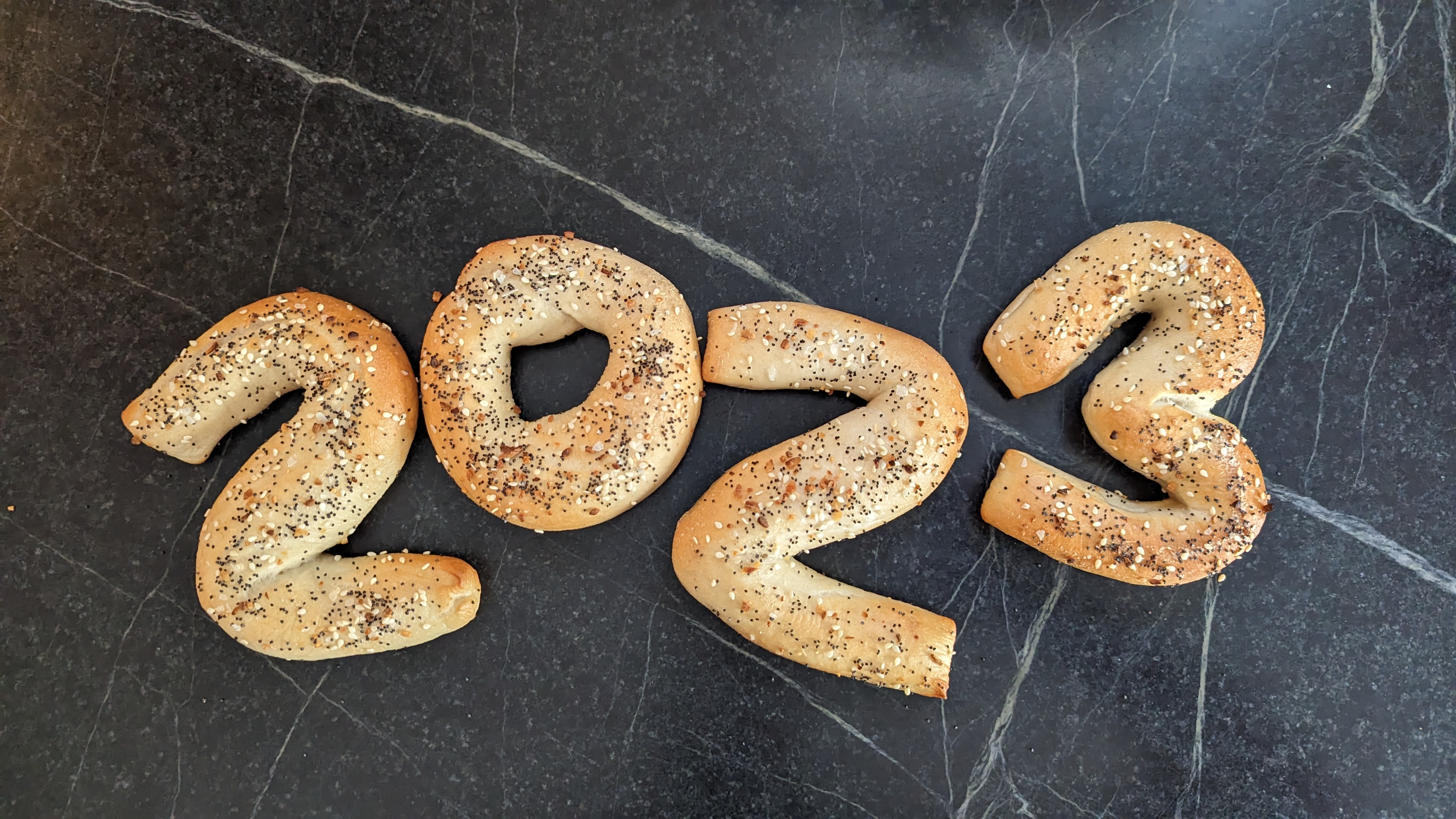 The number 2023 spelled out in bagels.